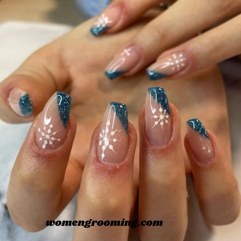 10. Blue Ombre Snowflake Nails