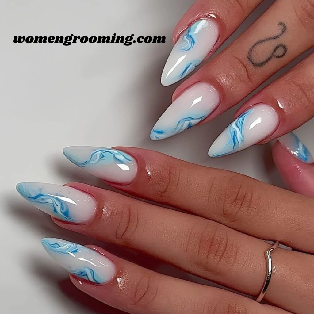 White Nails with Soft Blue Swirls